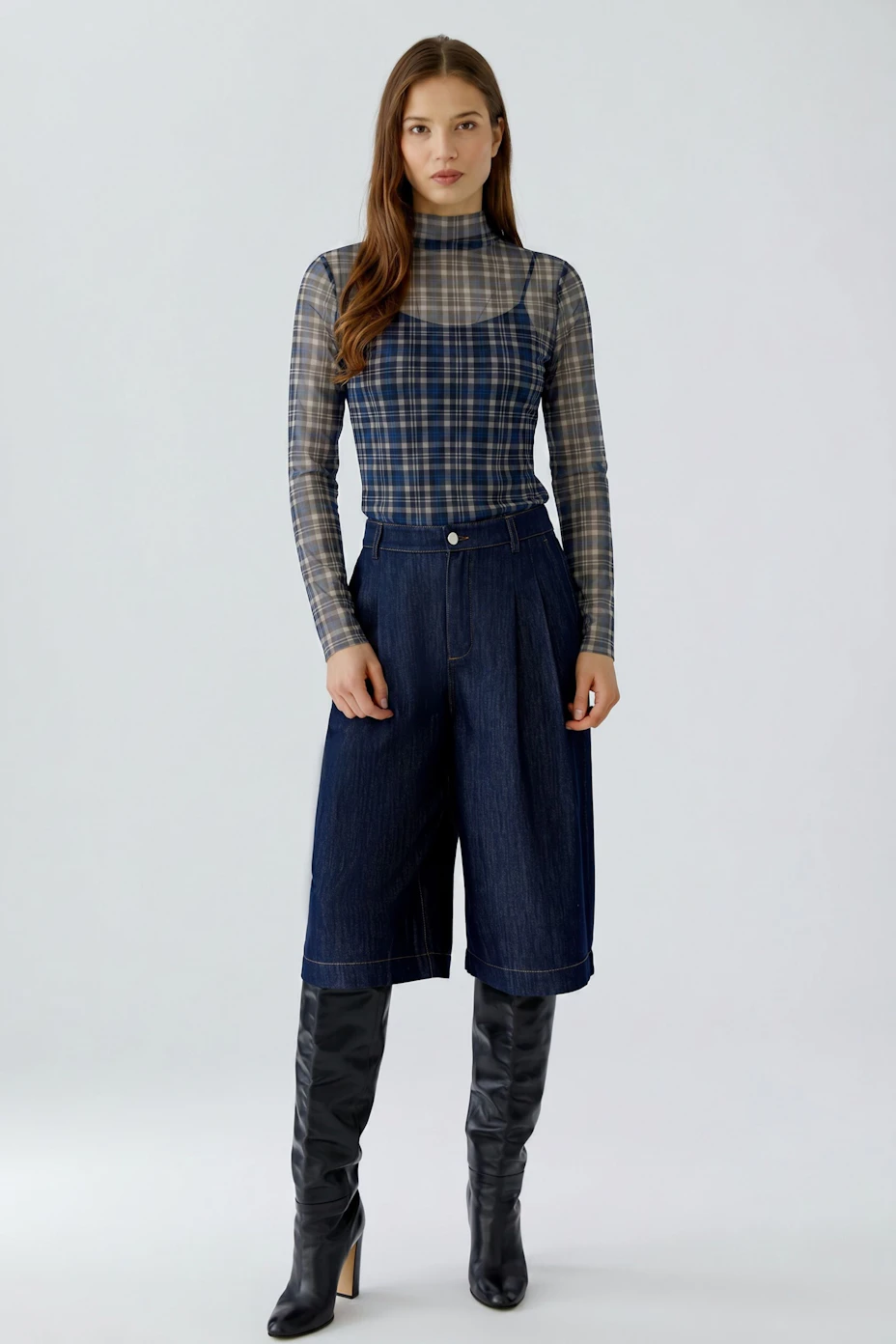 Plaid long-sleeve shirt: Blue and white checkered pattern, perfect for casual wear.