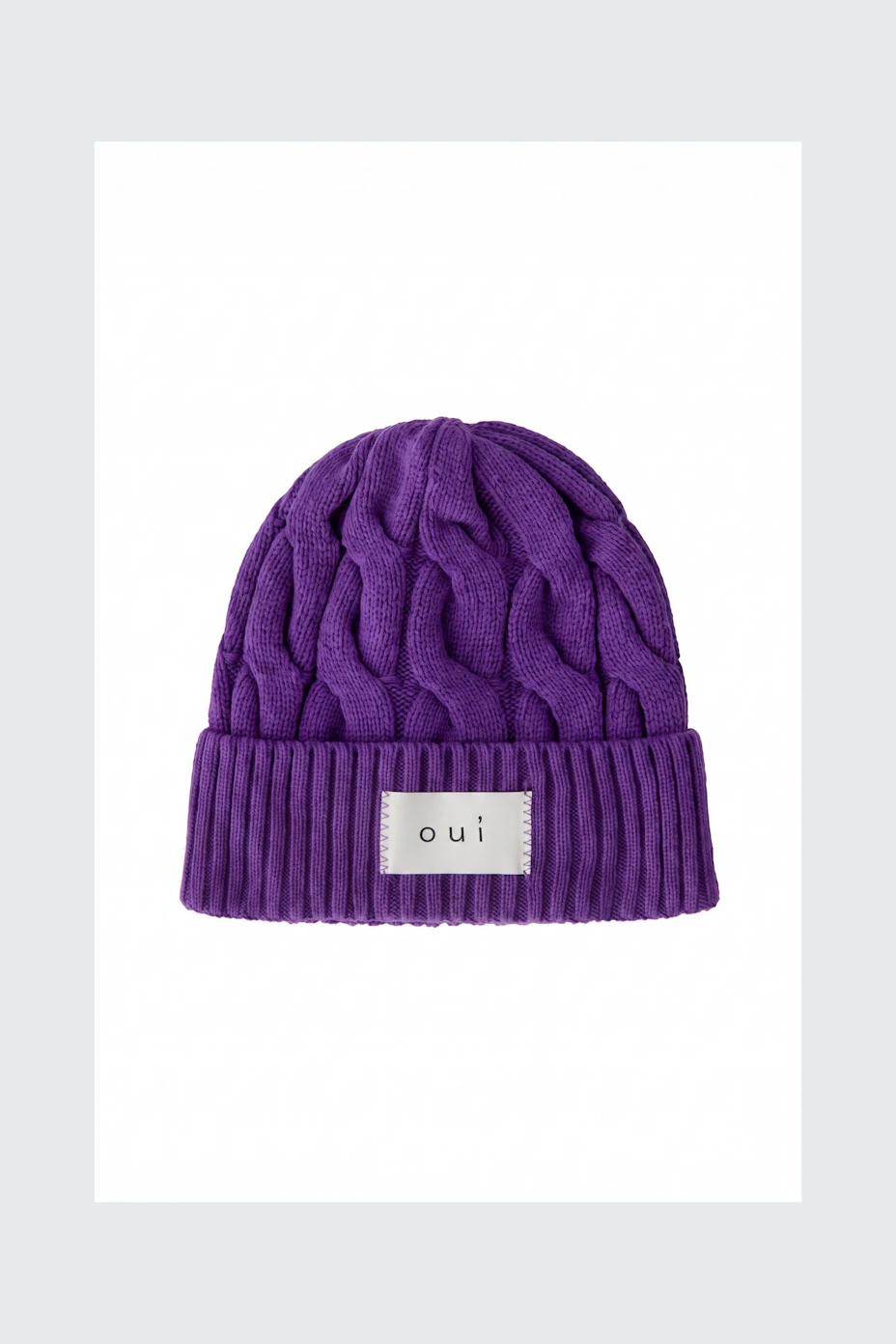 Purple knit beanie with ribbed cuff and 'oui' label, perfect for a cozy, stylish look.