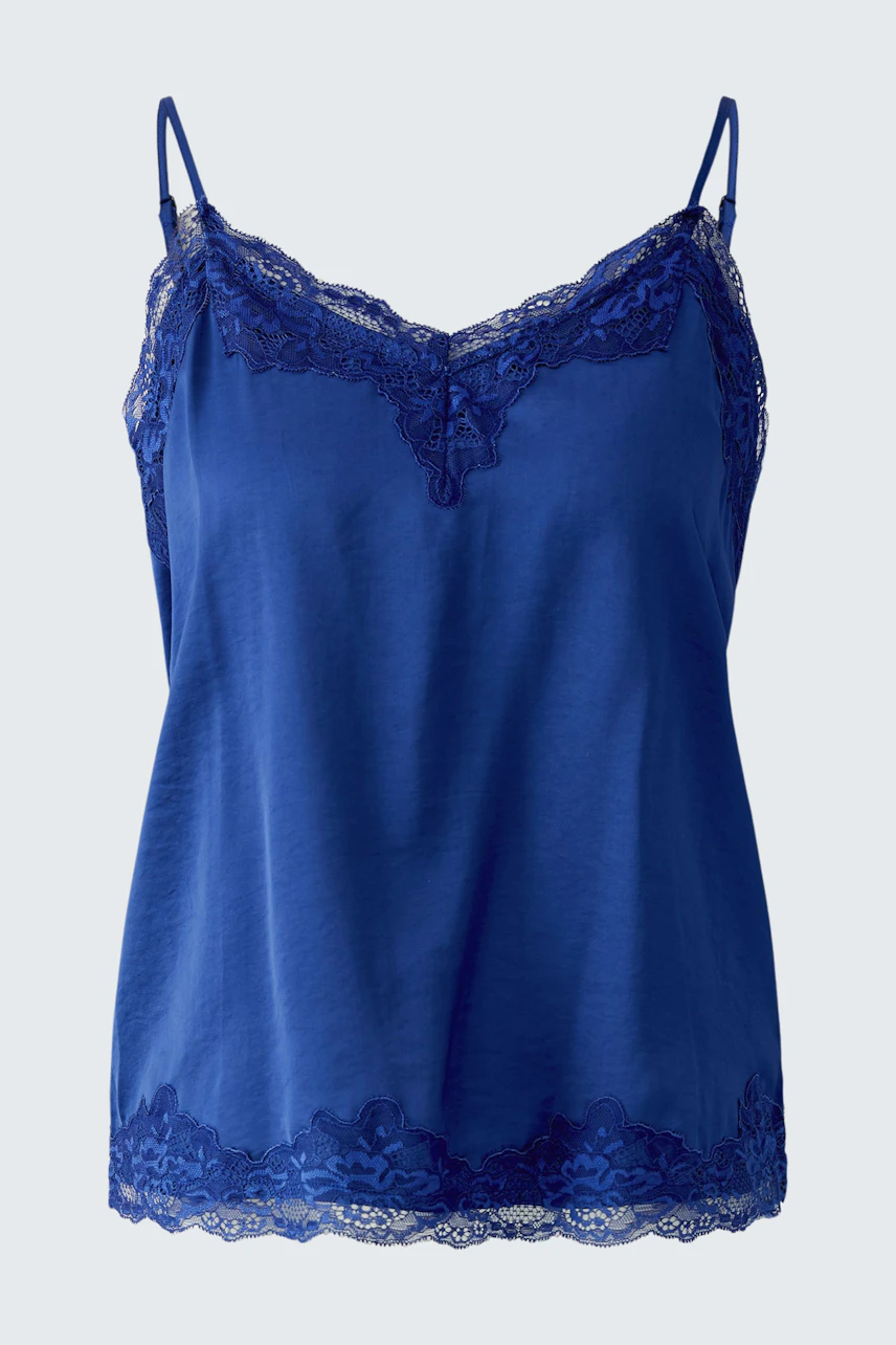 Blue lace-trimmed top: Sleeveless design with delicate lace details, perfect for layering or wearing alone.