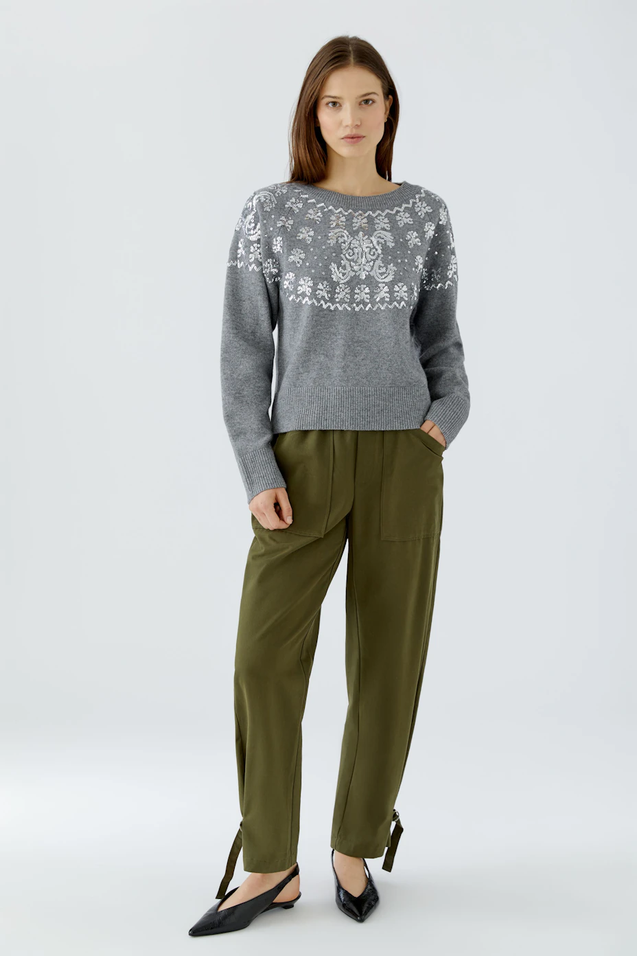 Cozy grey pullover with white patterns, perfect for casual wear. No model, just the pullover displayed.