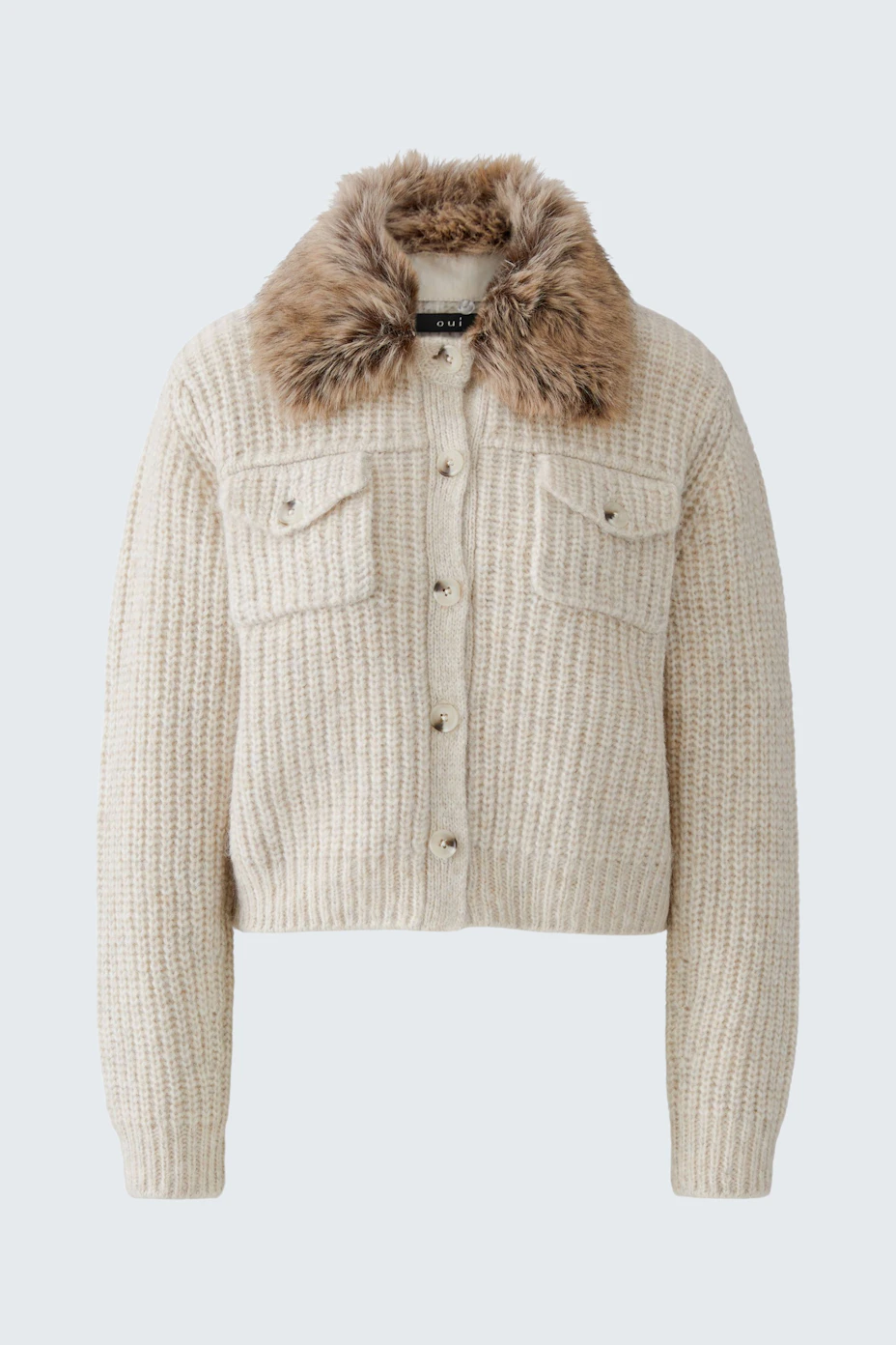 Cozy knit cardigan with faux fur collar, buttoned front, and two chest pockets. Perfect for layering.