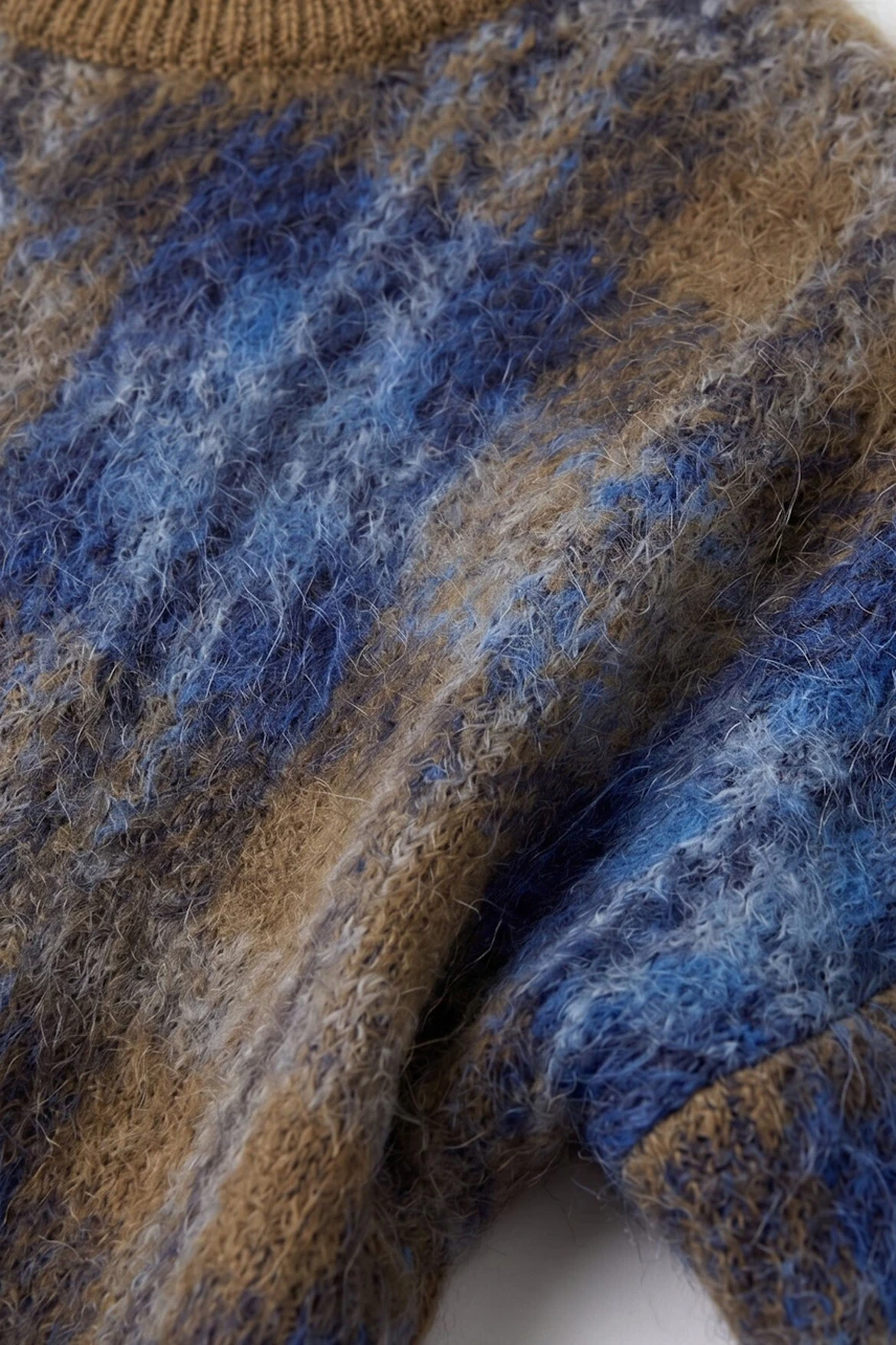 Textured pullover in blue and brown hues, showcasing a cozy and stylish knit pattern.