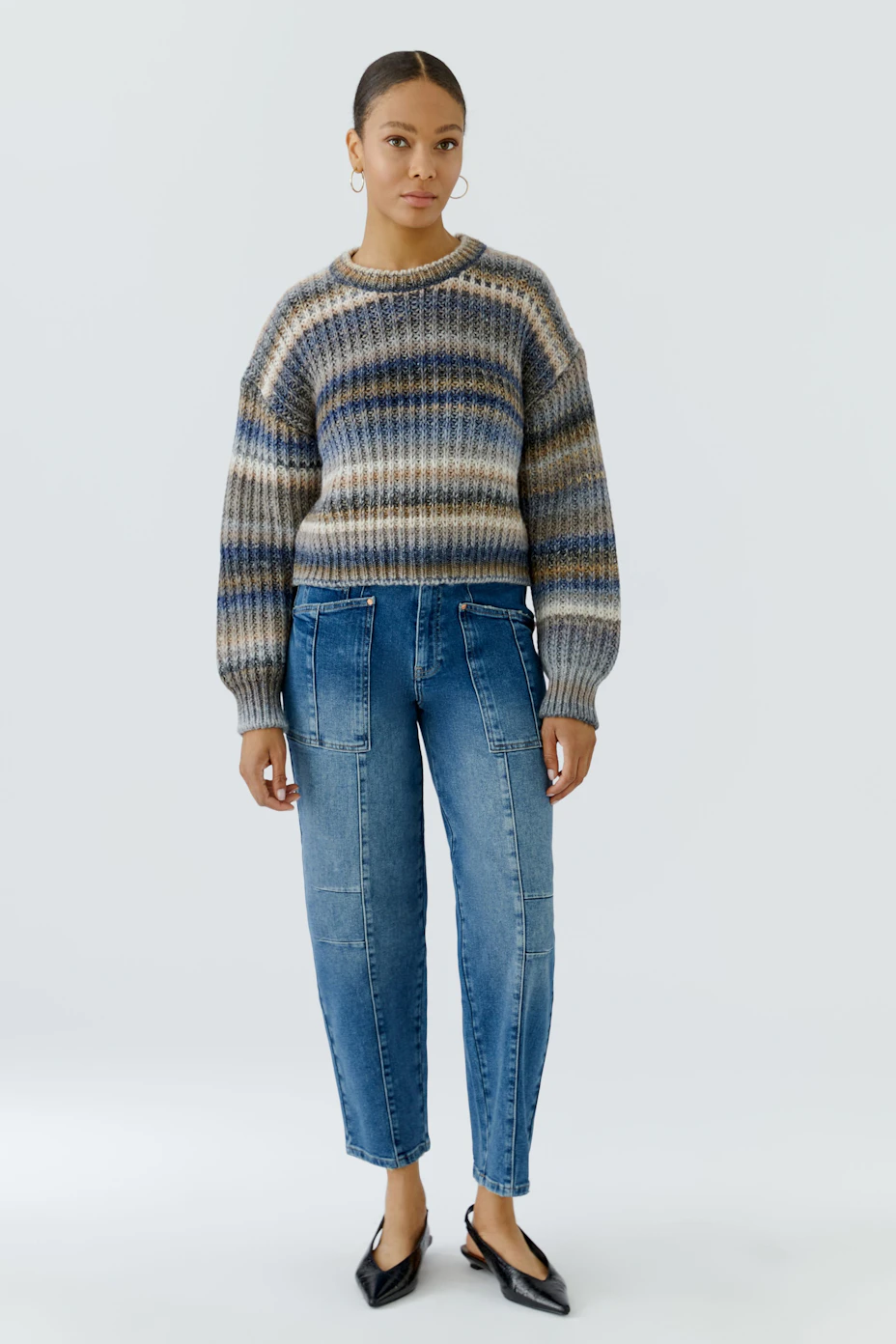 Striped pullover in earthy tones, featuring a cozy knit texture. Ideal for casual wear.