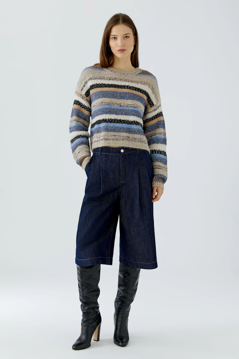 Striped pullover: Cozy knit with blue, beige, and black stripes, perfect for casual wear.