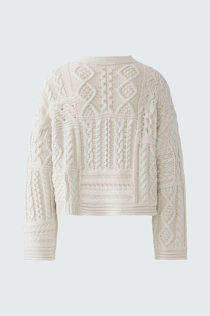 Cozy women's pullover: Cream knit pullover with intricate patterns, perfect for casual comfort.