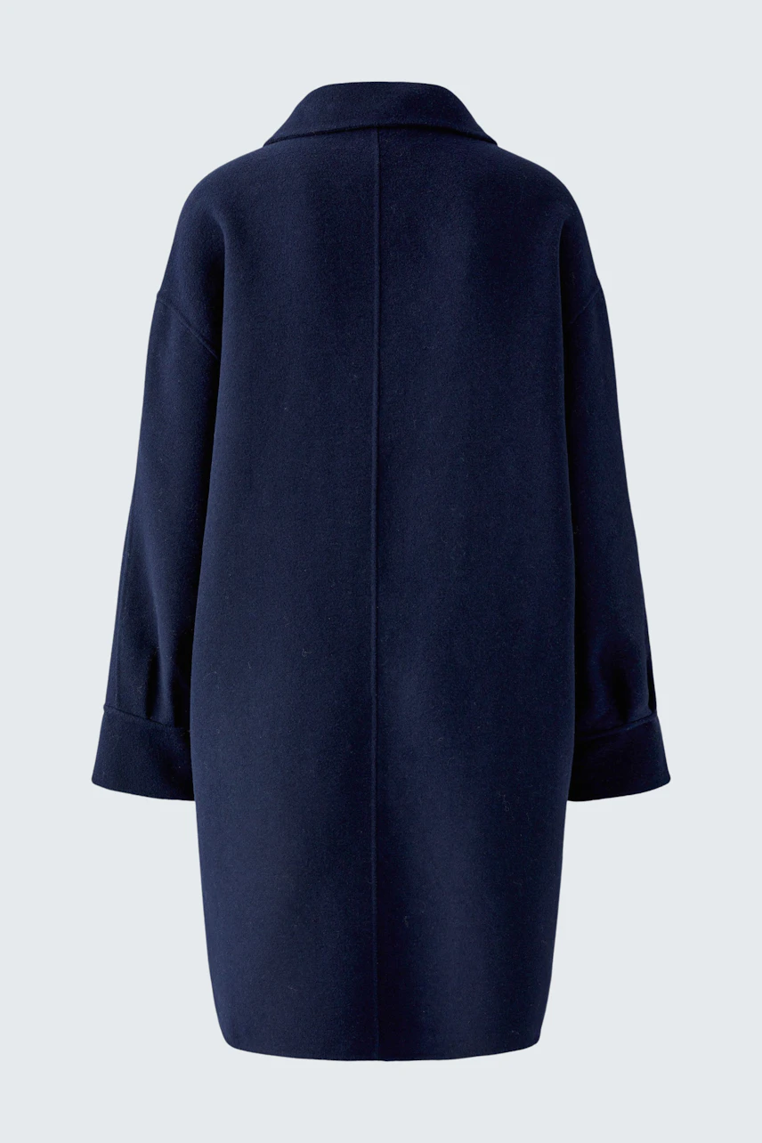 Navy wool coat: Simple, oversized design with wide sleeves, perfect for layering in cooler weather.