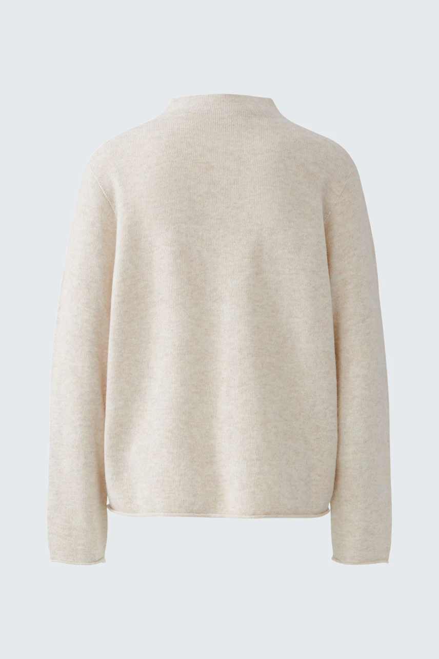 Casual women's pullover in beige, shown from the back. Simple design, perfect for everyday wear.