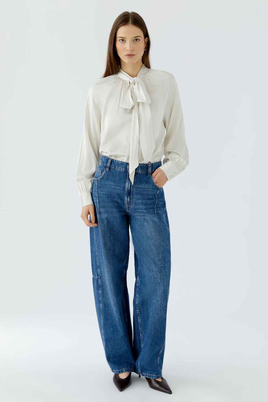 White pussy-bow blouse: Classic design with long sleeves and a stylish bow tie at the neck.