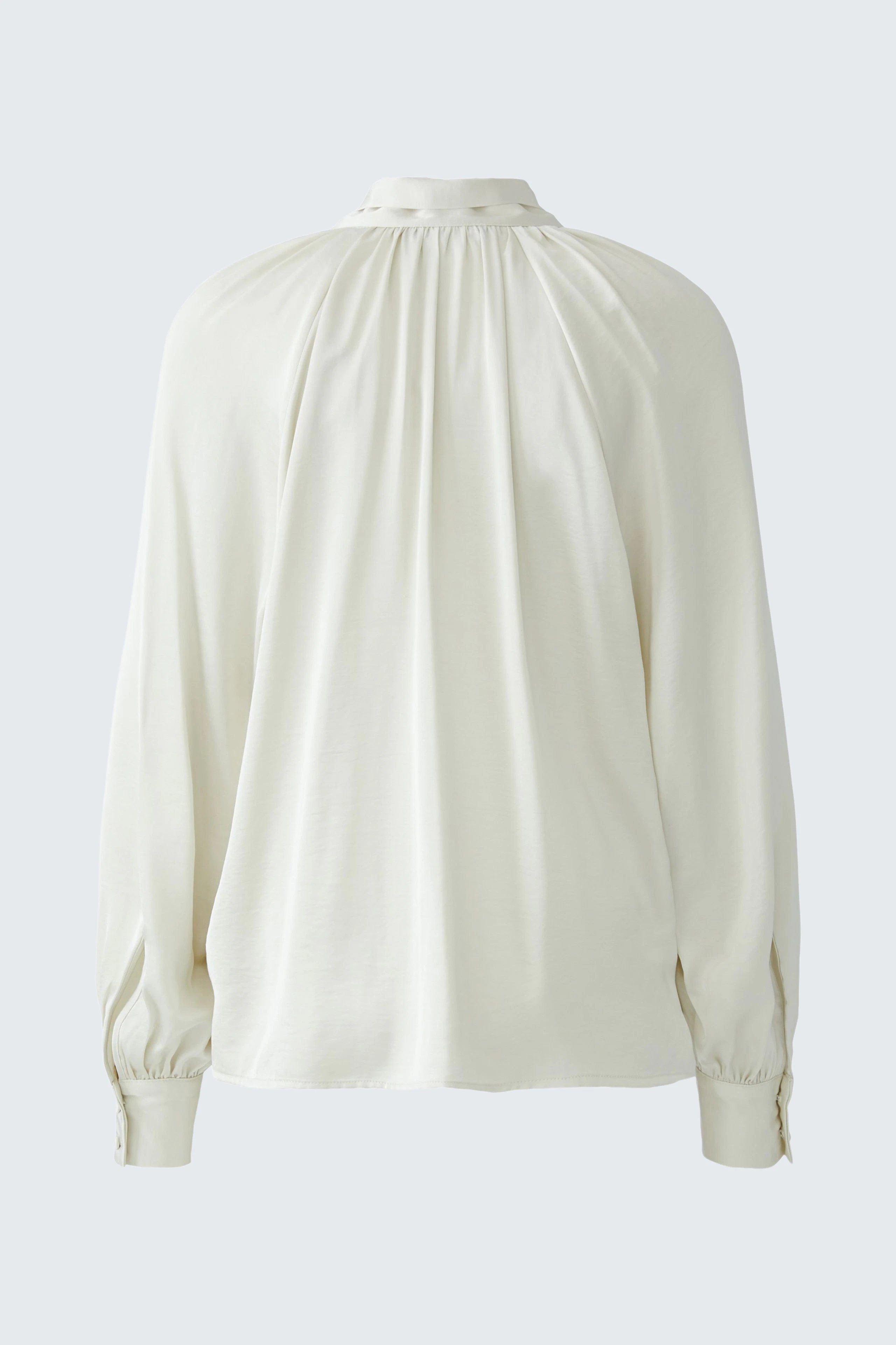 White bow blouse: Simple and stylish design with long sleeves, perfect for versatile outfits.