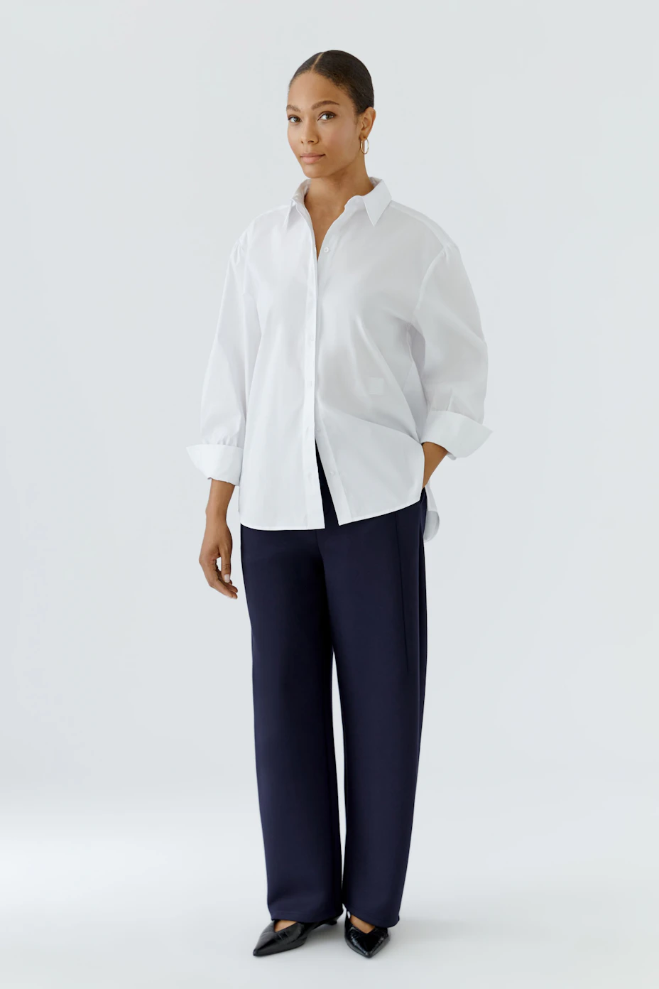 Classic women's shirt blouse in white, featuring a crisp collar and button-down front.