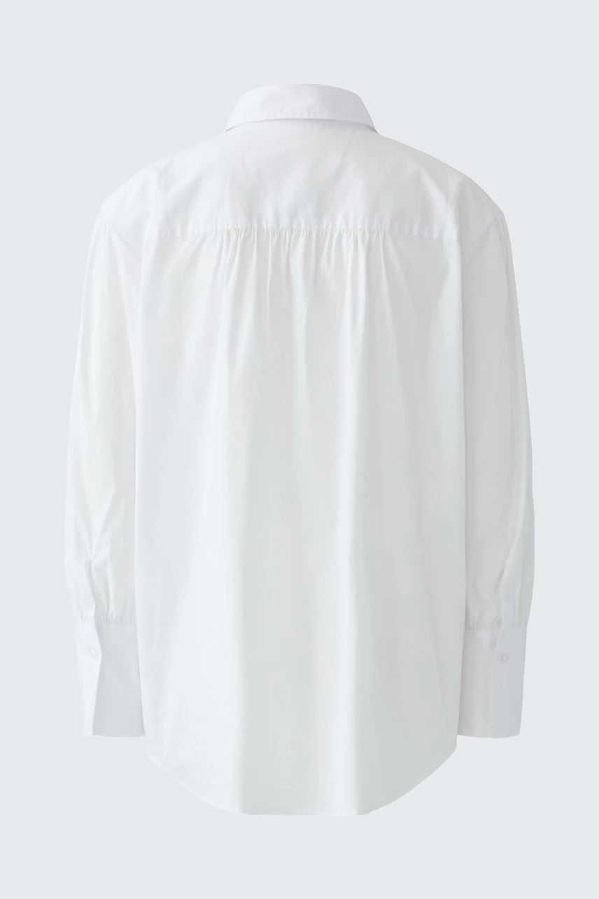 Classic women's shirt blouse in white, shown from the back. Simple and versatile for any wardrobe.
