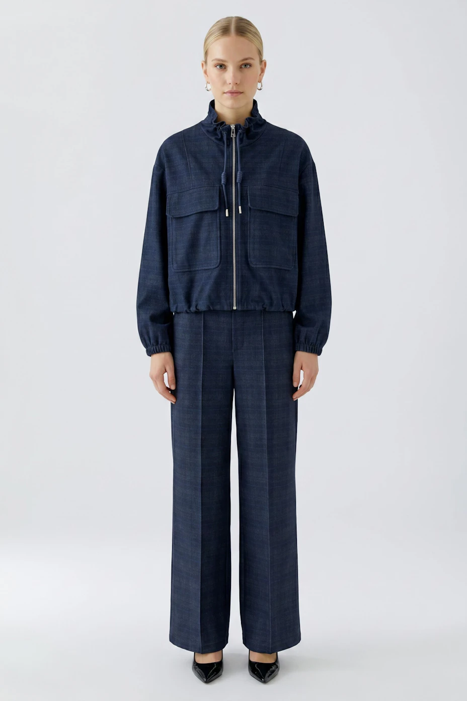 Casual women's jacket: Navy blue zip-up jacket with large front pockets and a high collar.