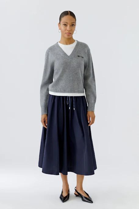Navy blue midi skirt with drawstring waist, perfect for casual outings.