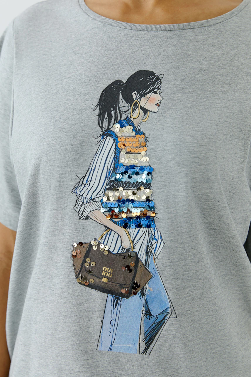 Casual women's T-shirt: Grey tee with a stylish print of a woman in sequined vest and jeans.