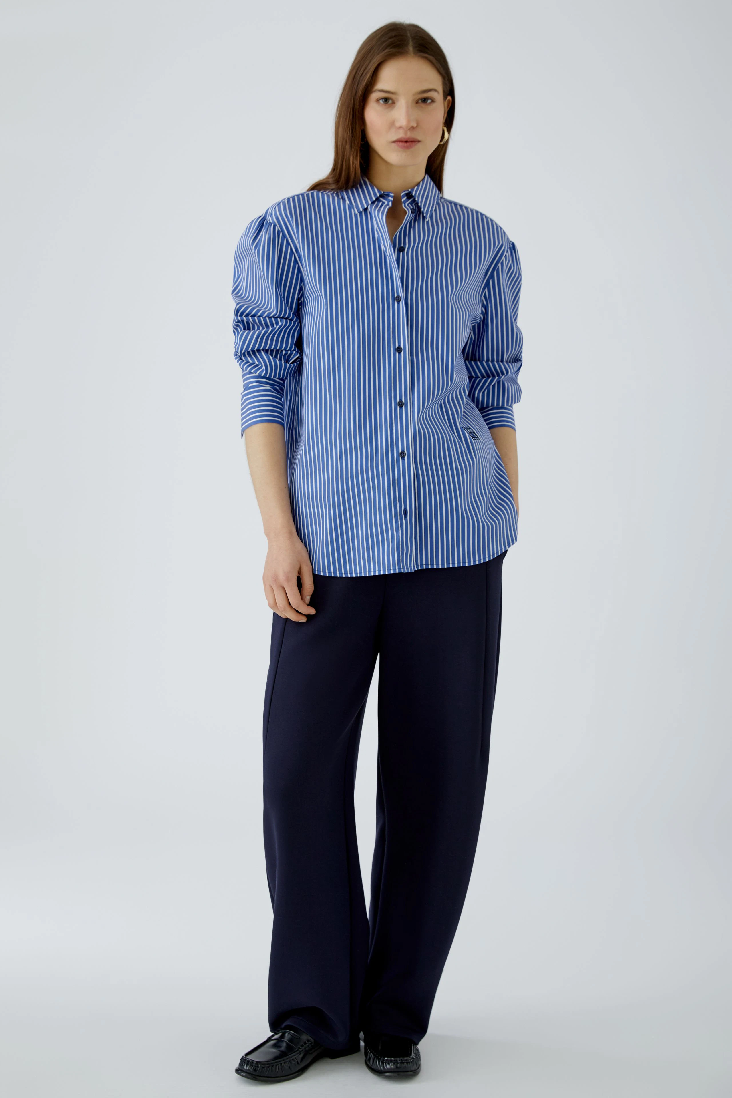 Casual women's shirt blouse: Blue and white striped button-up with long sleeves, perfect for everyday wear.