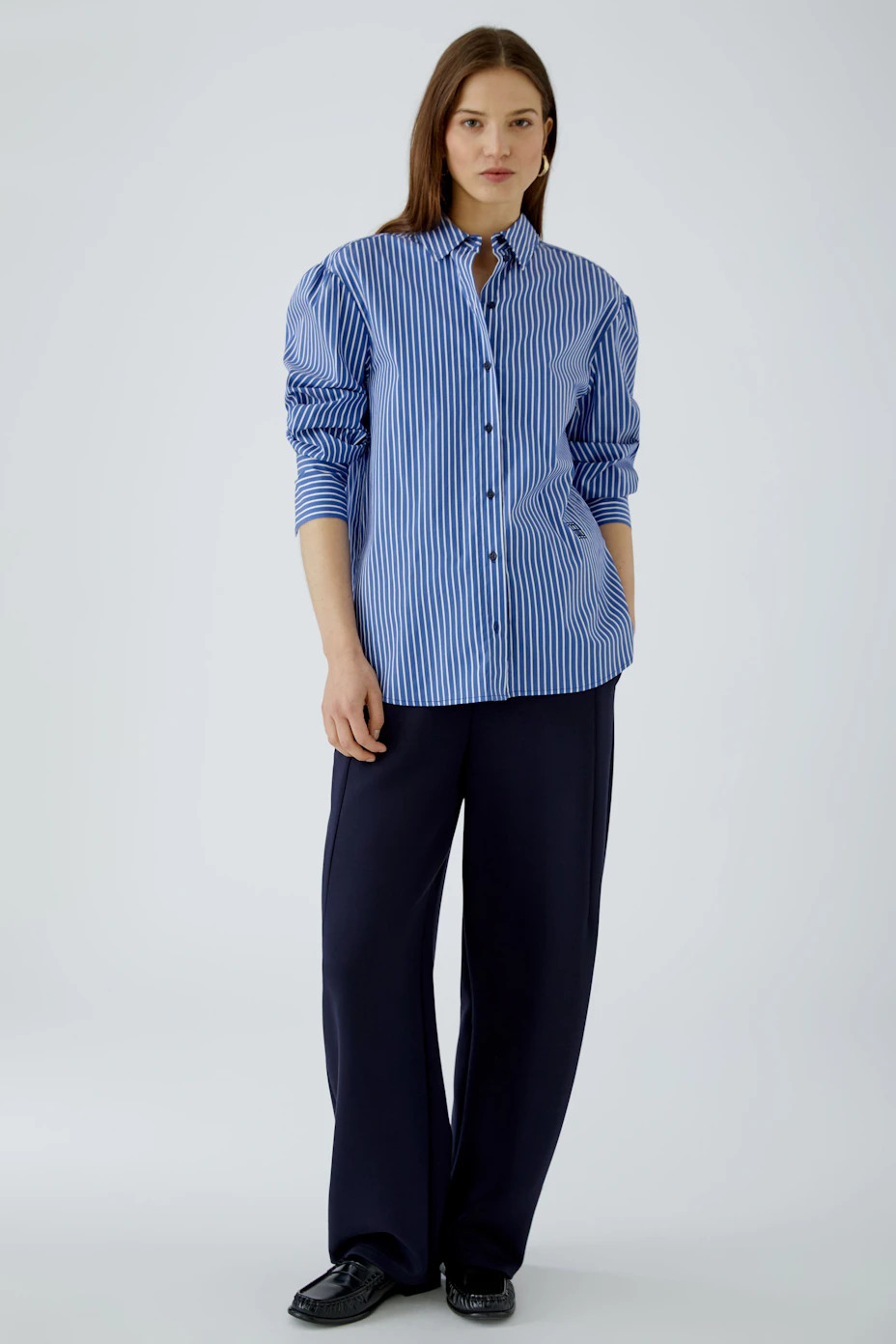 Casual women's shirt blouse: Blue and white striped button-up with long sleeves, perfect for everyday wear.