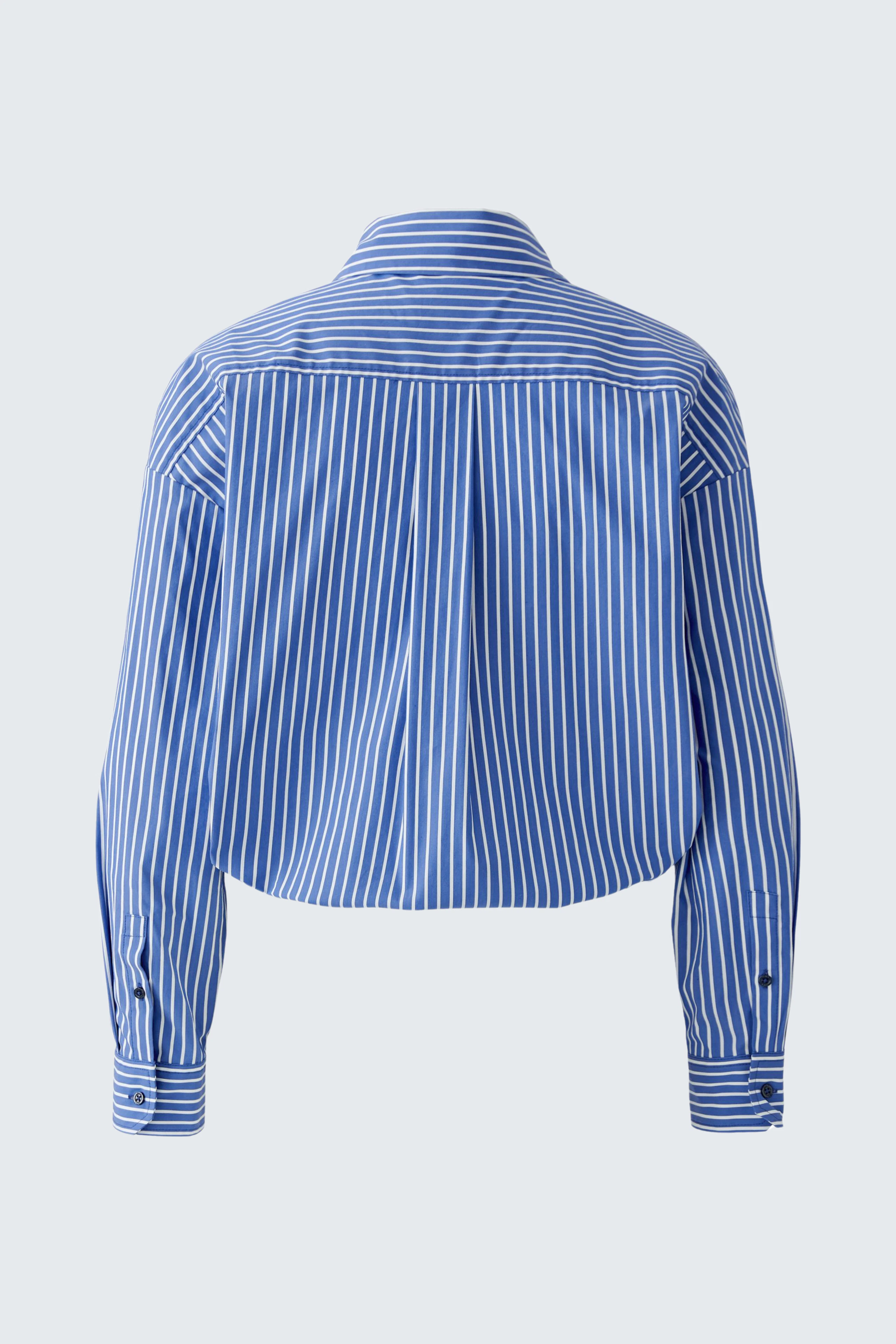 Striped women's shirt blouse in blue and white, shown from the back, highlighting its relaxed fit.