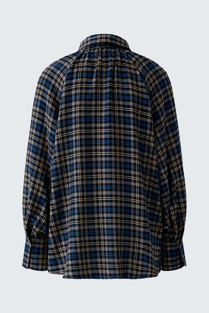 Casual women's blouse: Blue and black plaid blouse with long sleeves, shown from the back.