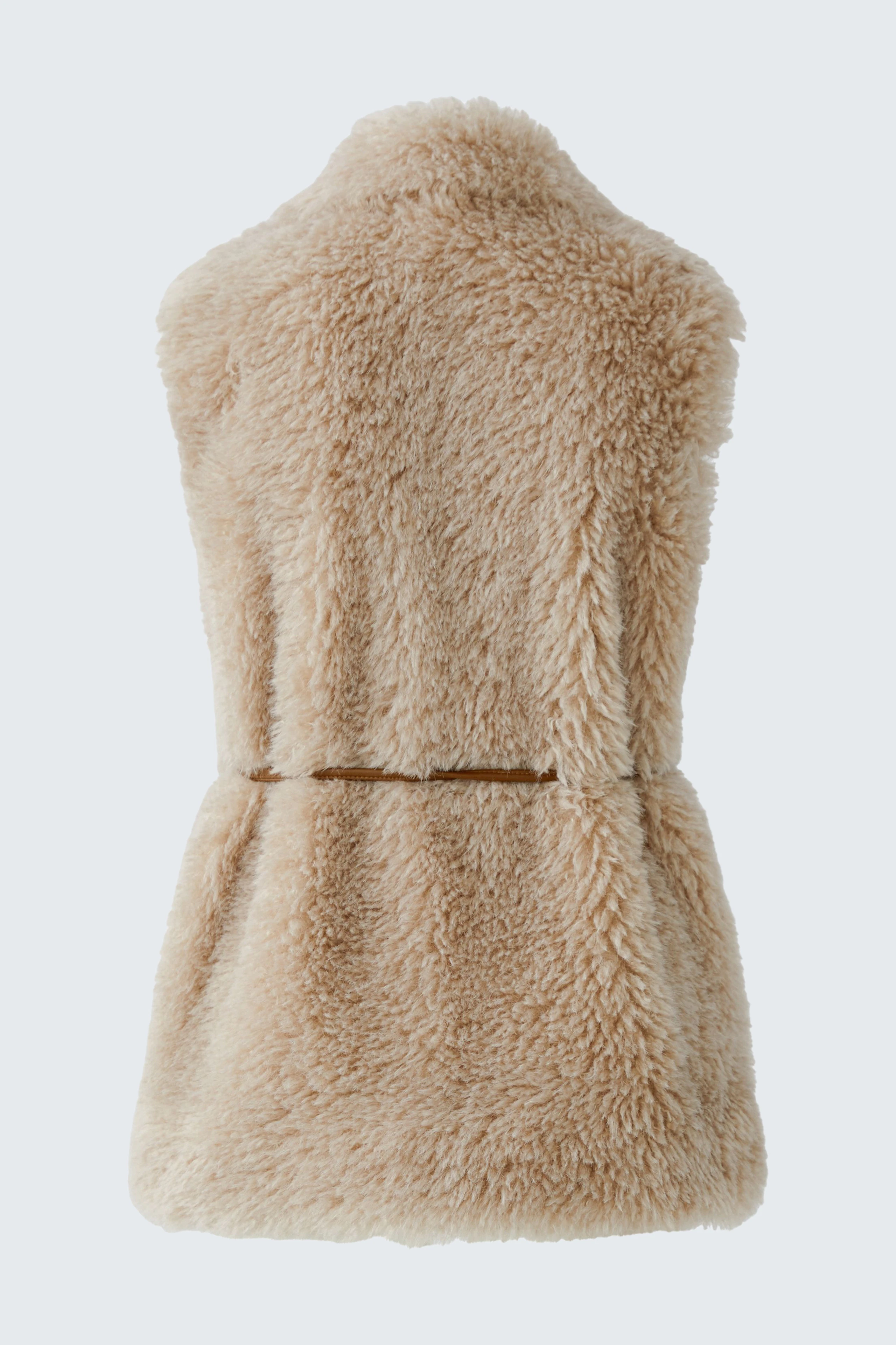 Cozy beige vest: Soft, fluffy texture, perfect for layering. No model, just the vest shown.