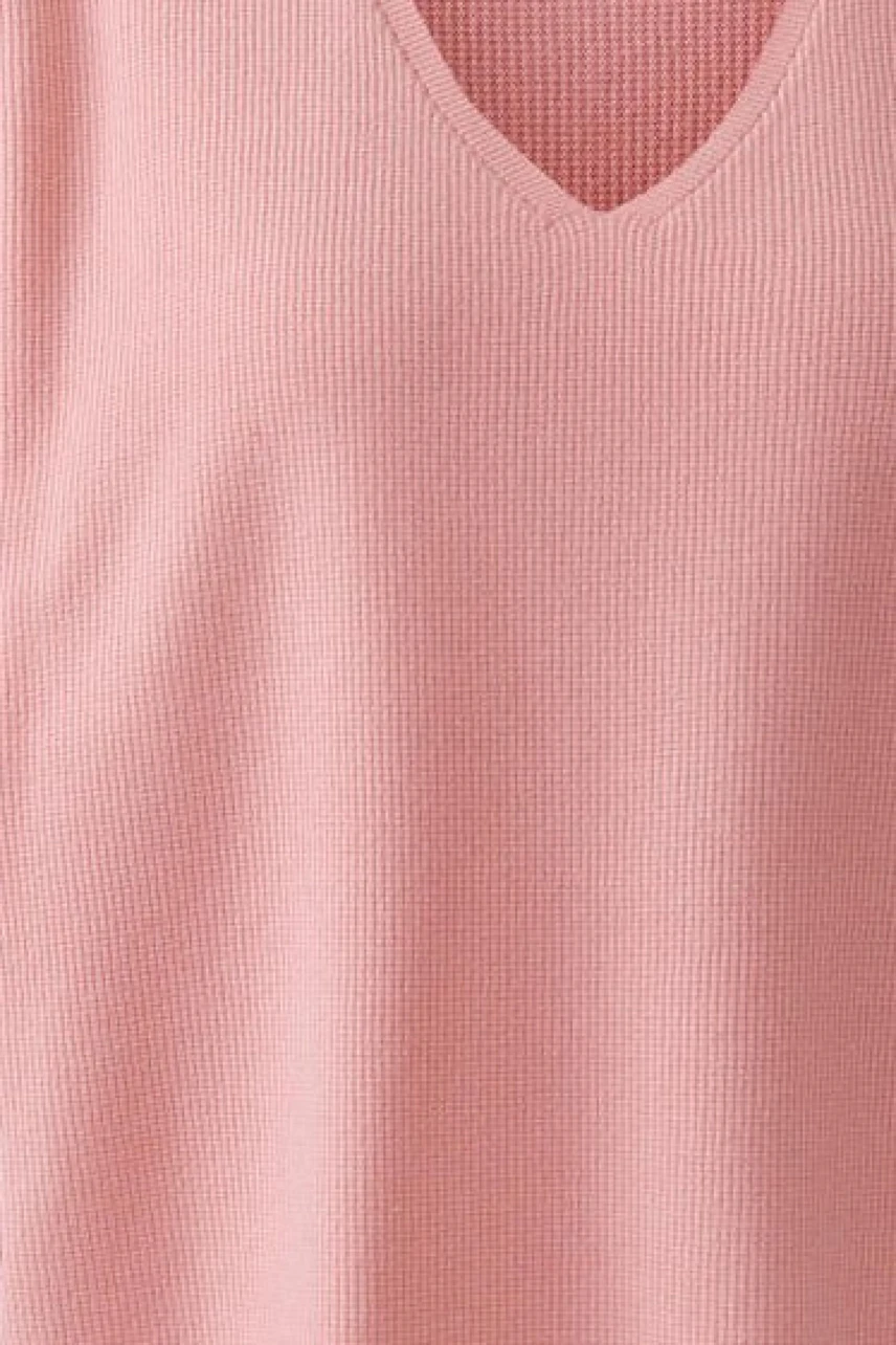 Textured pink pullover with a V-neck, showcasing a simple and casual style.