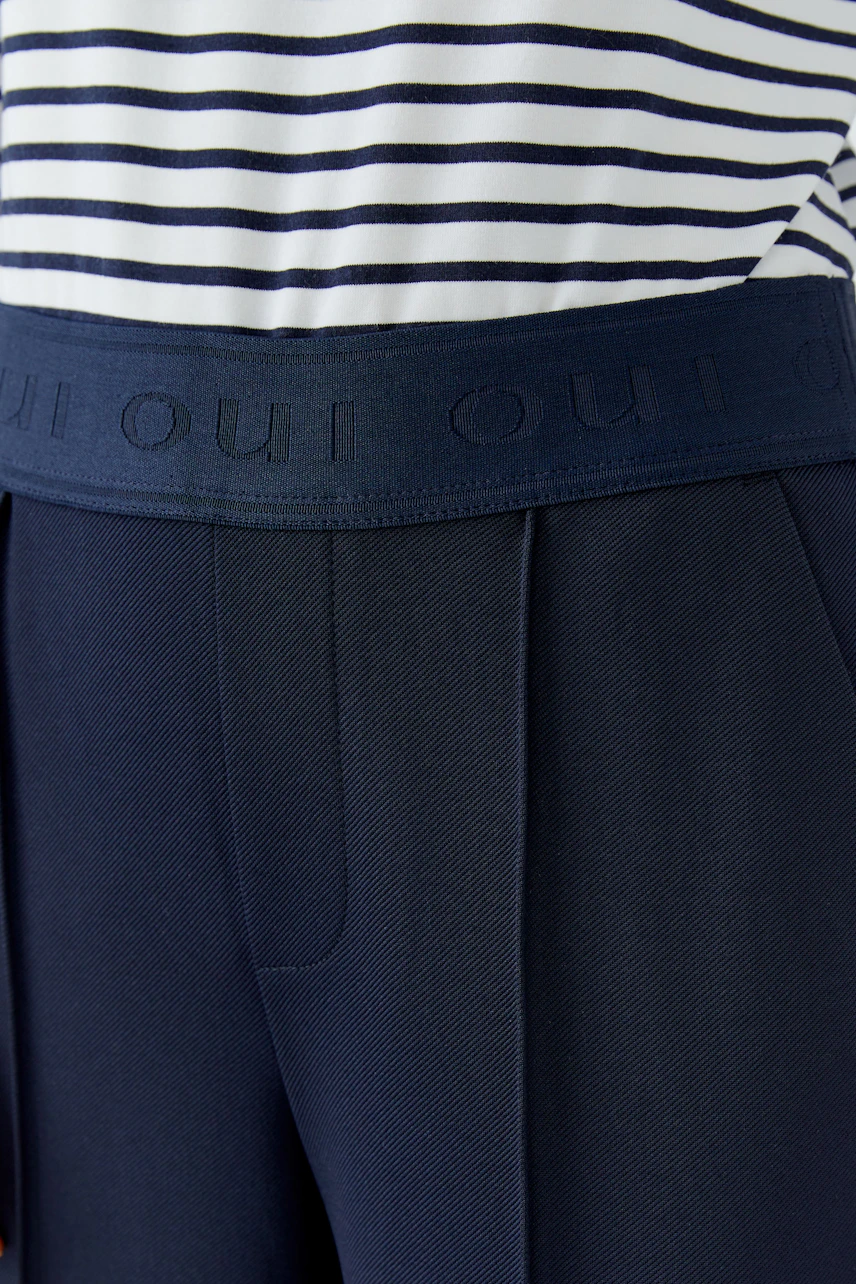 Comfortable women's trousers with a wide waistband and side pockets, perfect for casual wear.