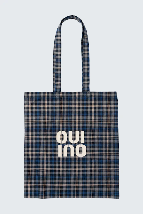 Plaid tote bag with 'OUI' logo in white. Perfect for casual outings and everyday use.