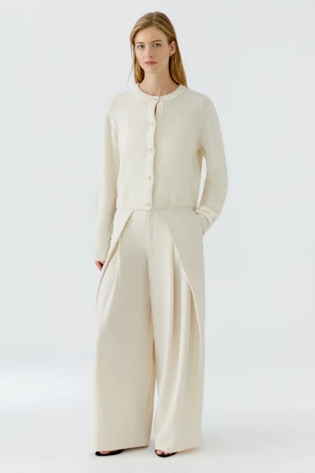 Pleated trousers: Cream-colored wide-leg pants with front pleats, no model visible.