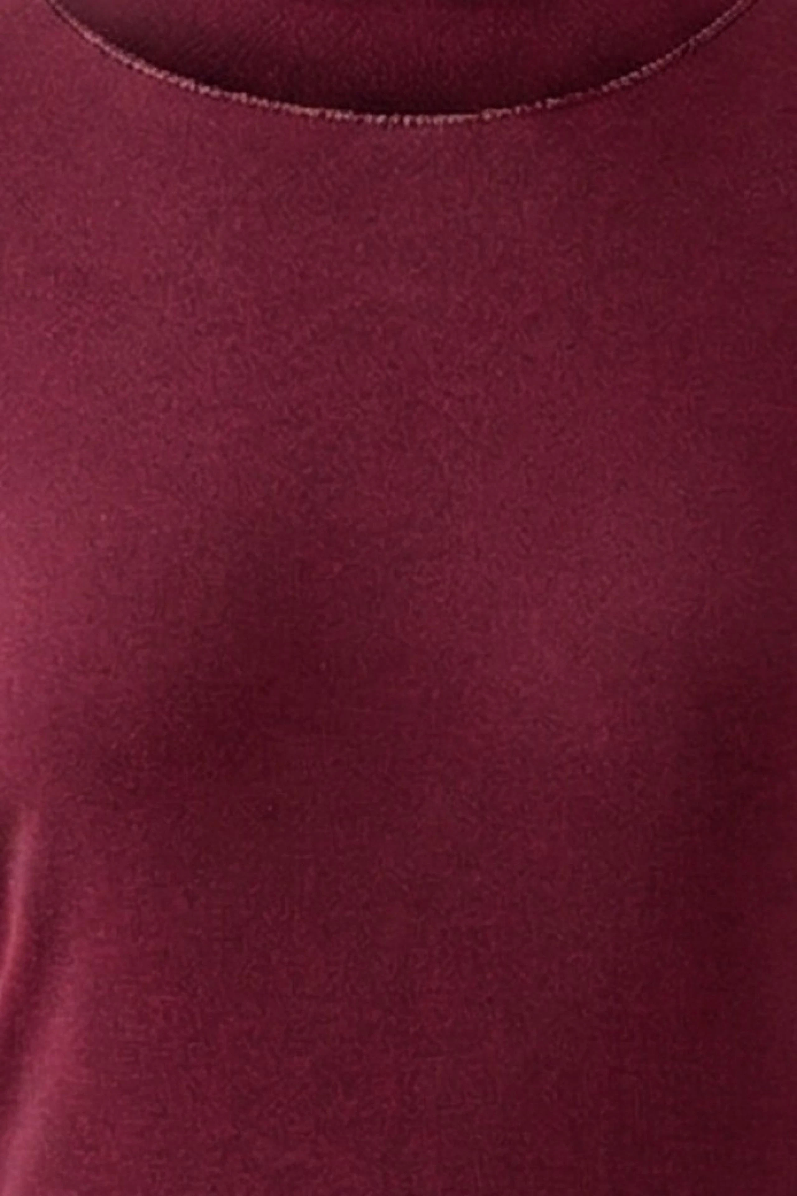 Women's long-sleeve shirt in rich burgundy, showcasing a simple and versatile design.