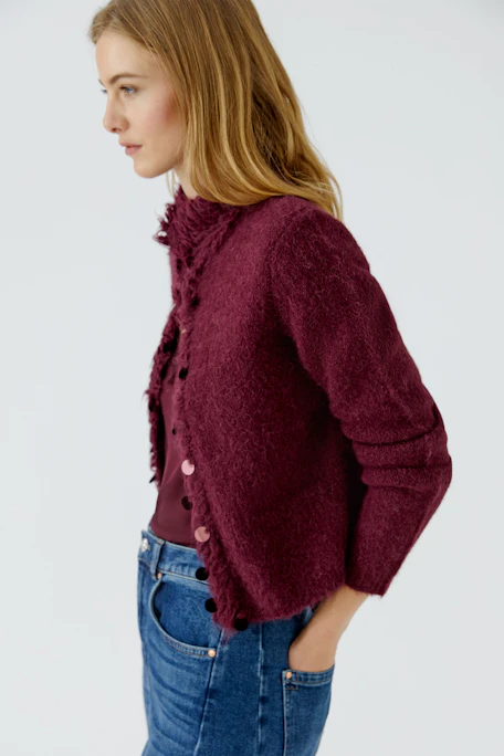 Burgundy knit cardigan: Cozy, textured design with button front, perfect for layering in cooler weather.