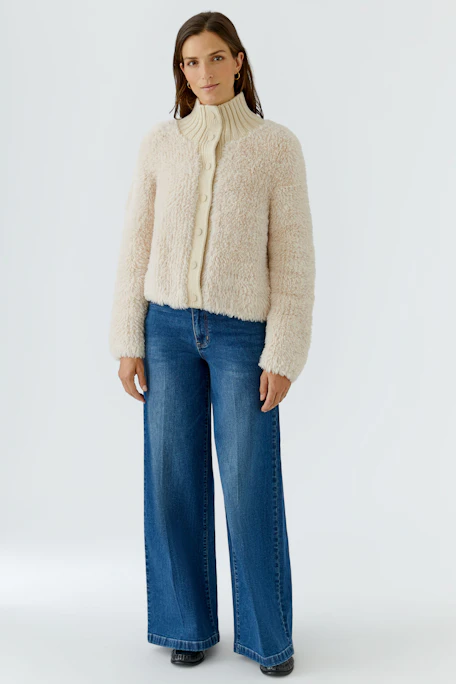 Cozy women's cardigan: Cream knit cardigan with a high collar and button front, perfect for layering.