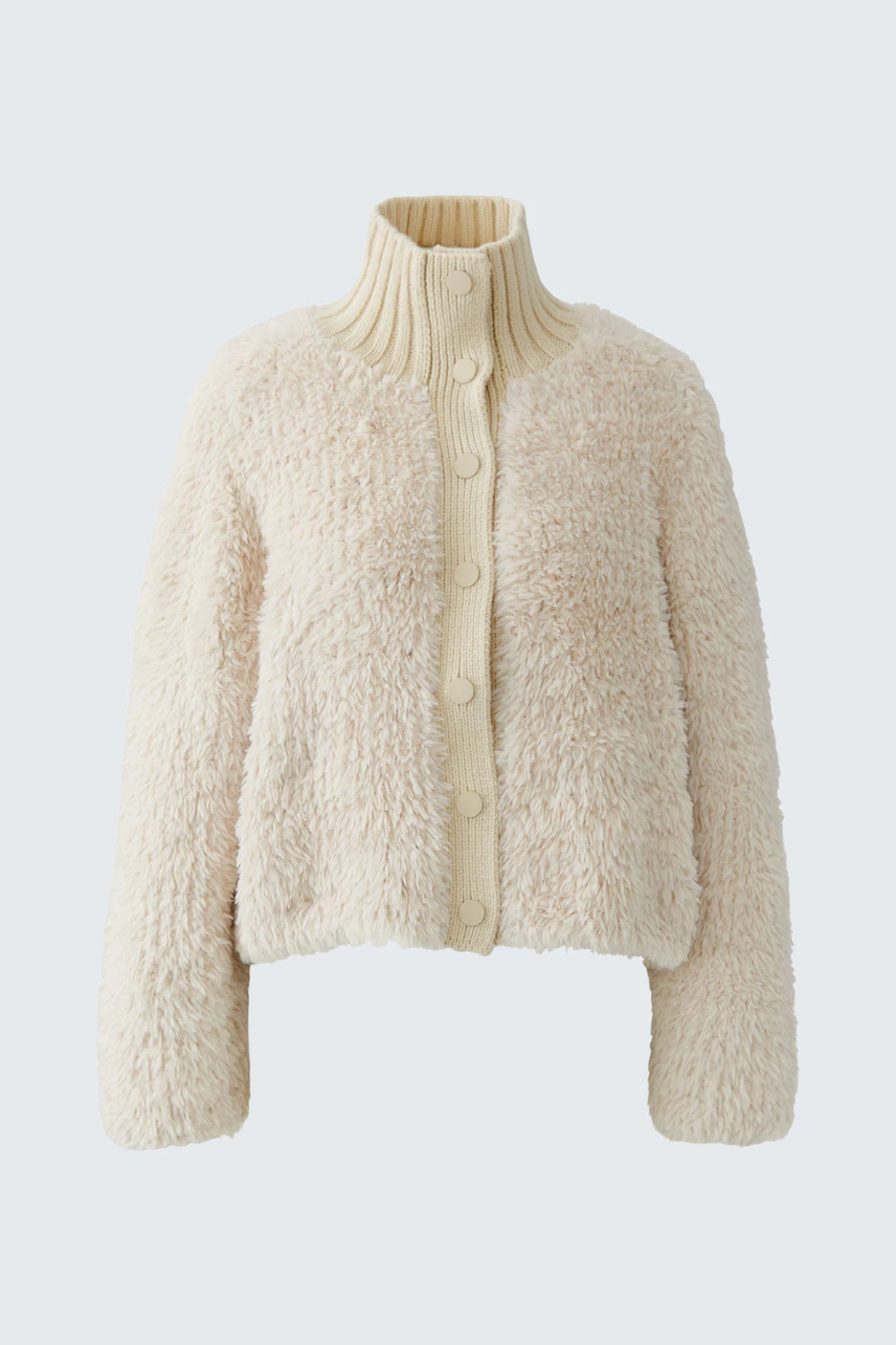 Cozy women's cardigan: Cream knit cardigan with a high collar and button front, perfect for layering.
