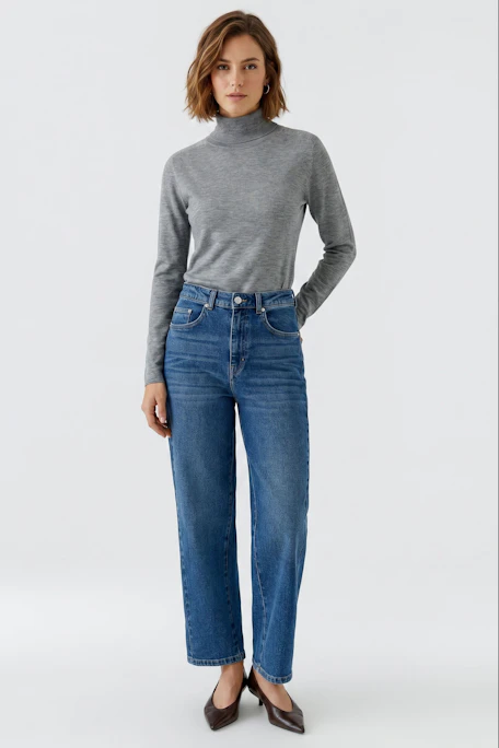 Simple grey pullover: A basic grey pullover with a high neck and long sleeves, perfect for layering.