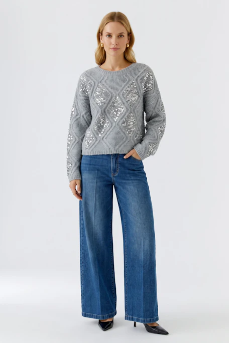 Grey pullover with textured knit and sequin details, perfect for a stylish and cozy look.