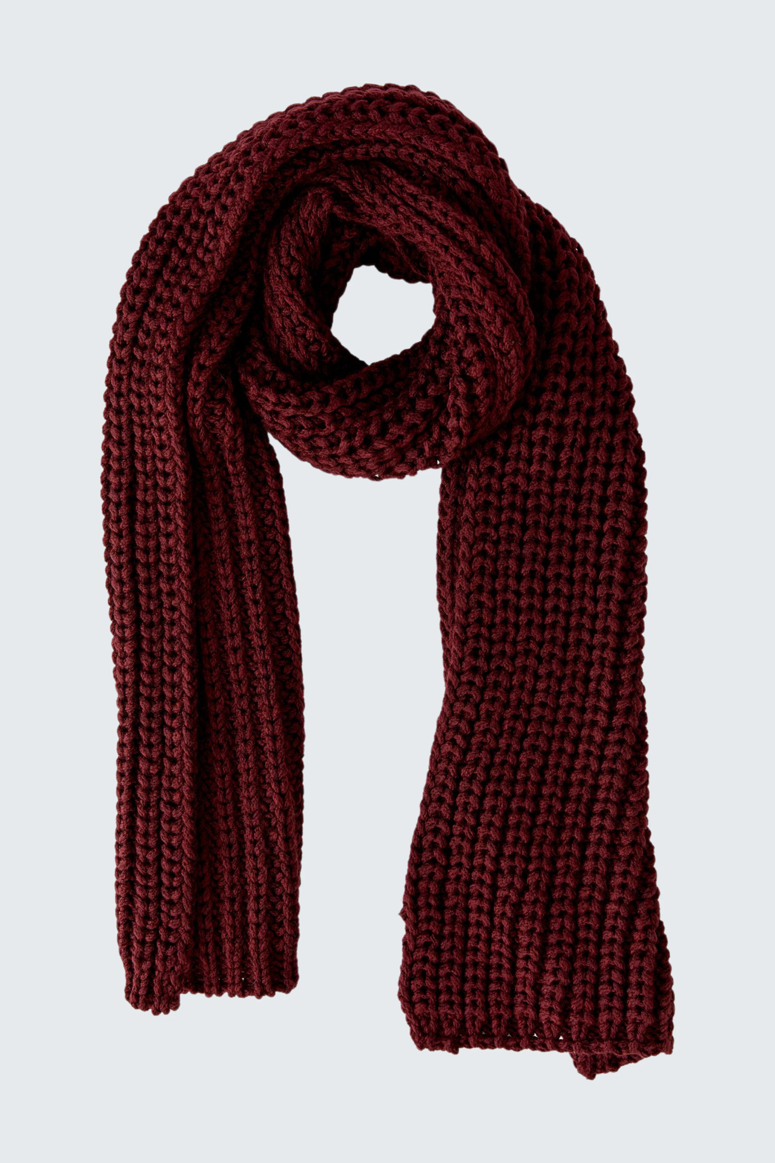 Chunky knit scarf in deep red, perfect for cozy warmth. No model, just the scarf displayed.