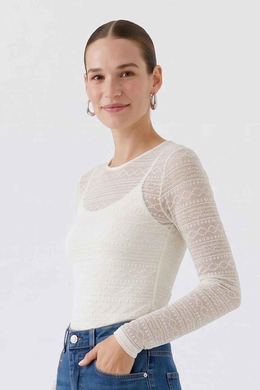 Textured long-sleeve shirt in white lace pattern, perfect for layering or standalone wear.