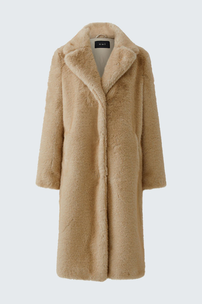 Cozy winter coat: Beige faux fur coat with a soft texture, perfect for warmth and style.