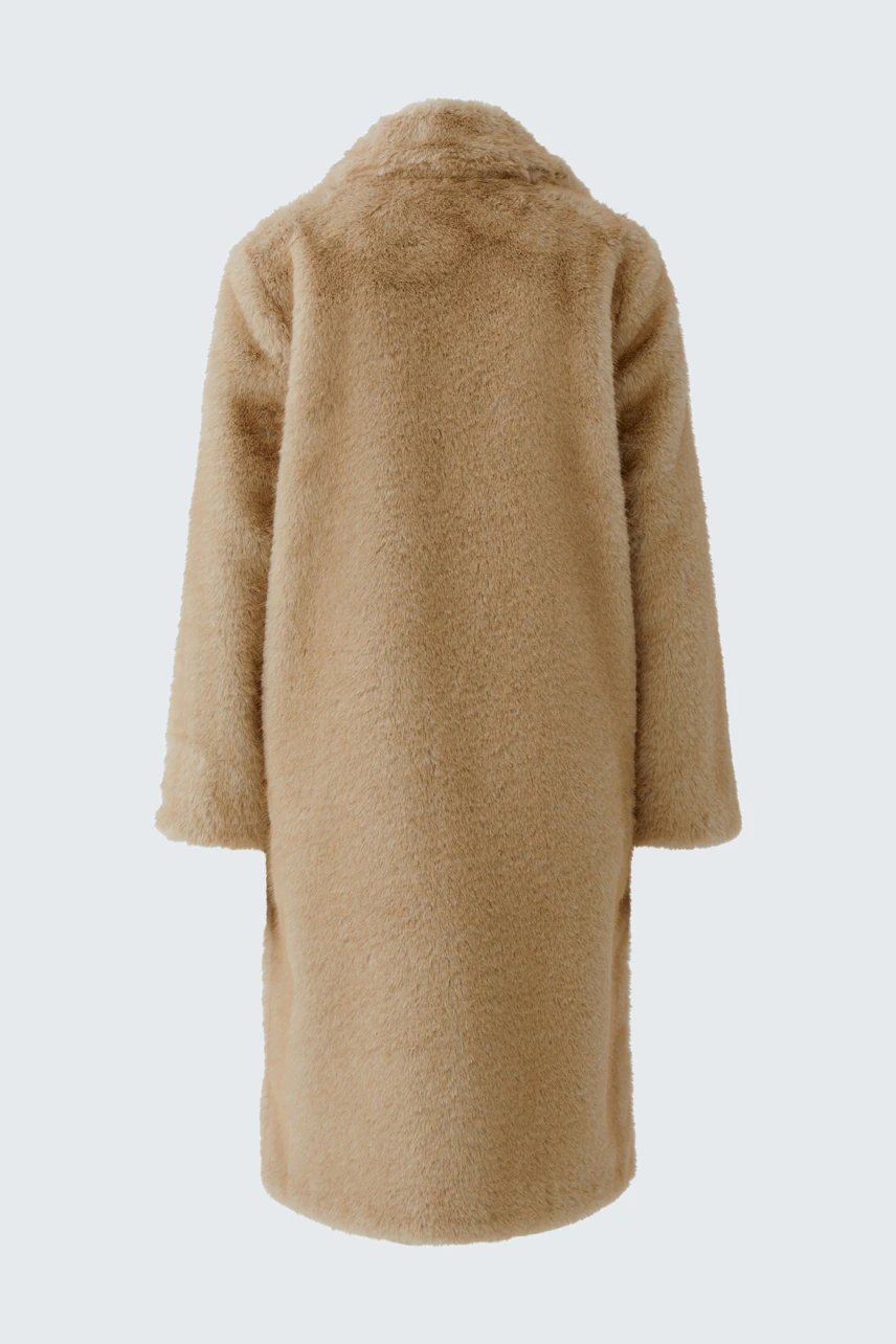 Cozy winter coat: Beige, long, and fluffy, perfect for warmth and style in cold weather.