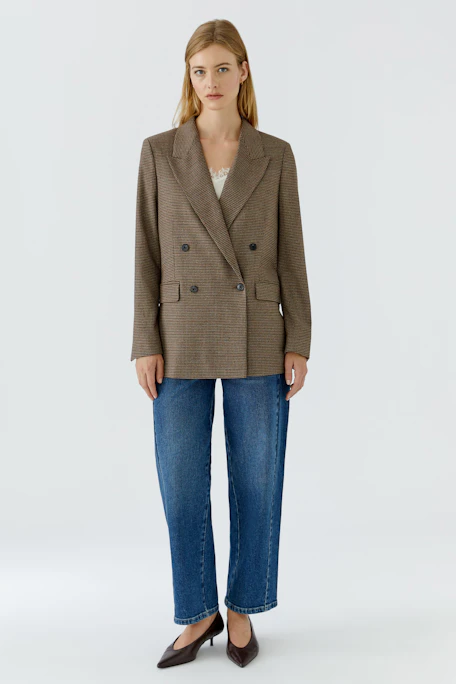 Classic women's blazer: Brown checkered double-breasted blazer with wide lapels, no model shown.