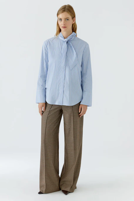 Striped pussy-bow blouse: Blue and white striped blouse with a large bow tie, no model shown.