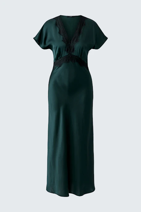 Dark green dress with lace trim, short sleeves, and a flowing silhouette. No model, just the dress.