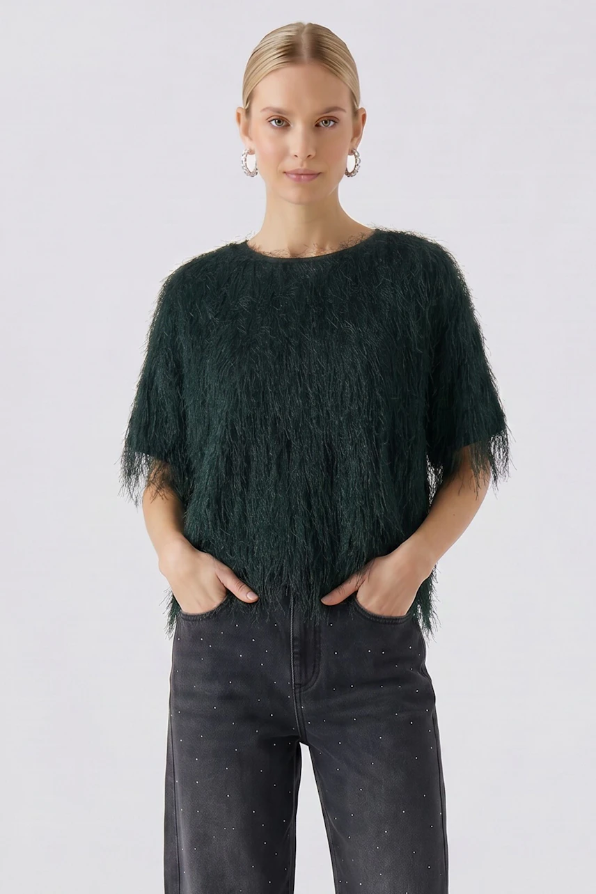 Casual women's T-shirt: Woman in a textured dark green T-shirt with short sleeves and relaxed fit.
