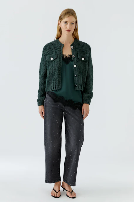 Cozy knit cardigan with button front and textured design, perfect for layering in cooler weather.