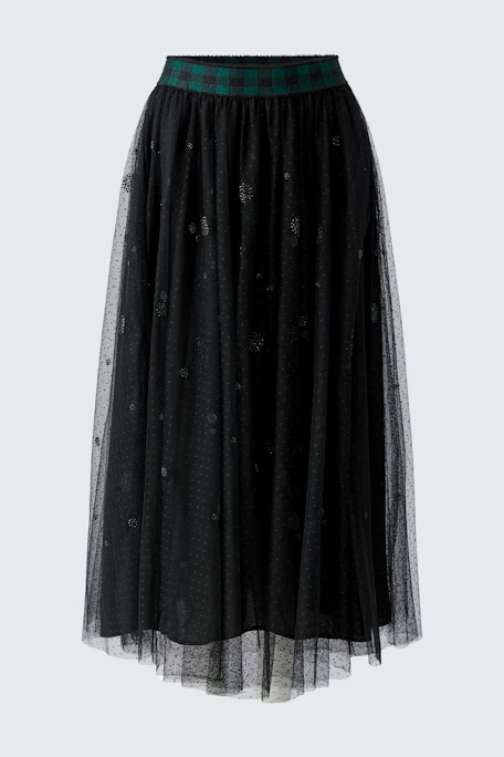 Black A-line skirt with sheer overlay and plaid waistband, displayed on a hanger.