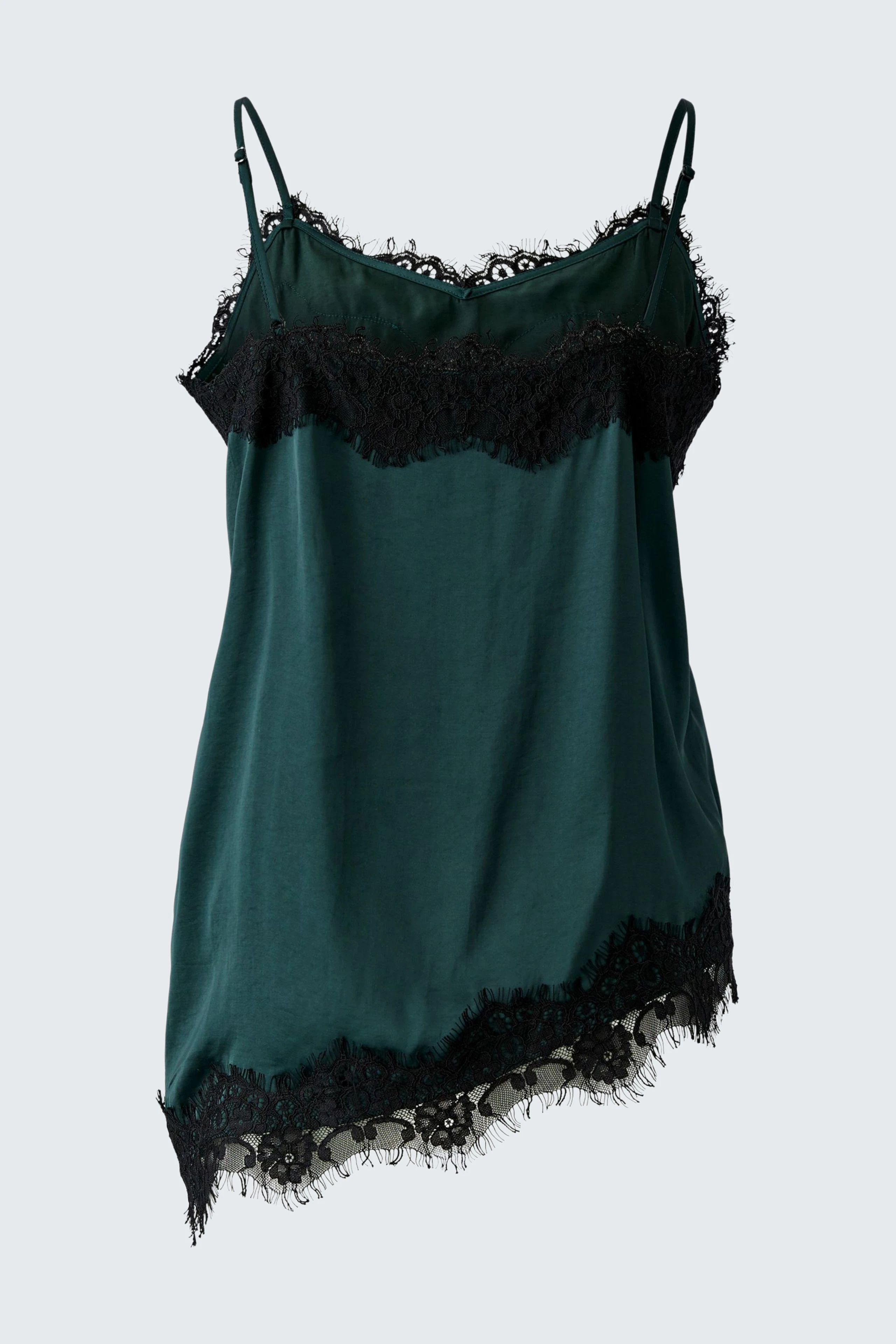 Green lace-trimmed top: Sleeveless design with delicate lace details, perfect for layering or wearing alone.