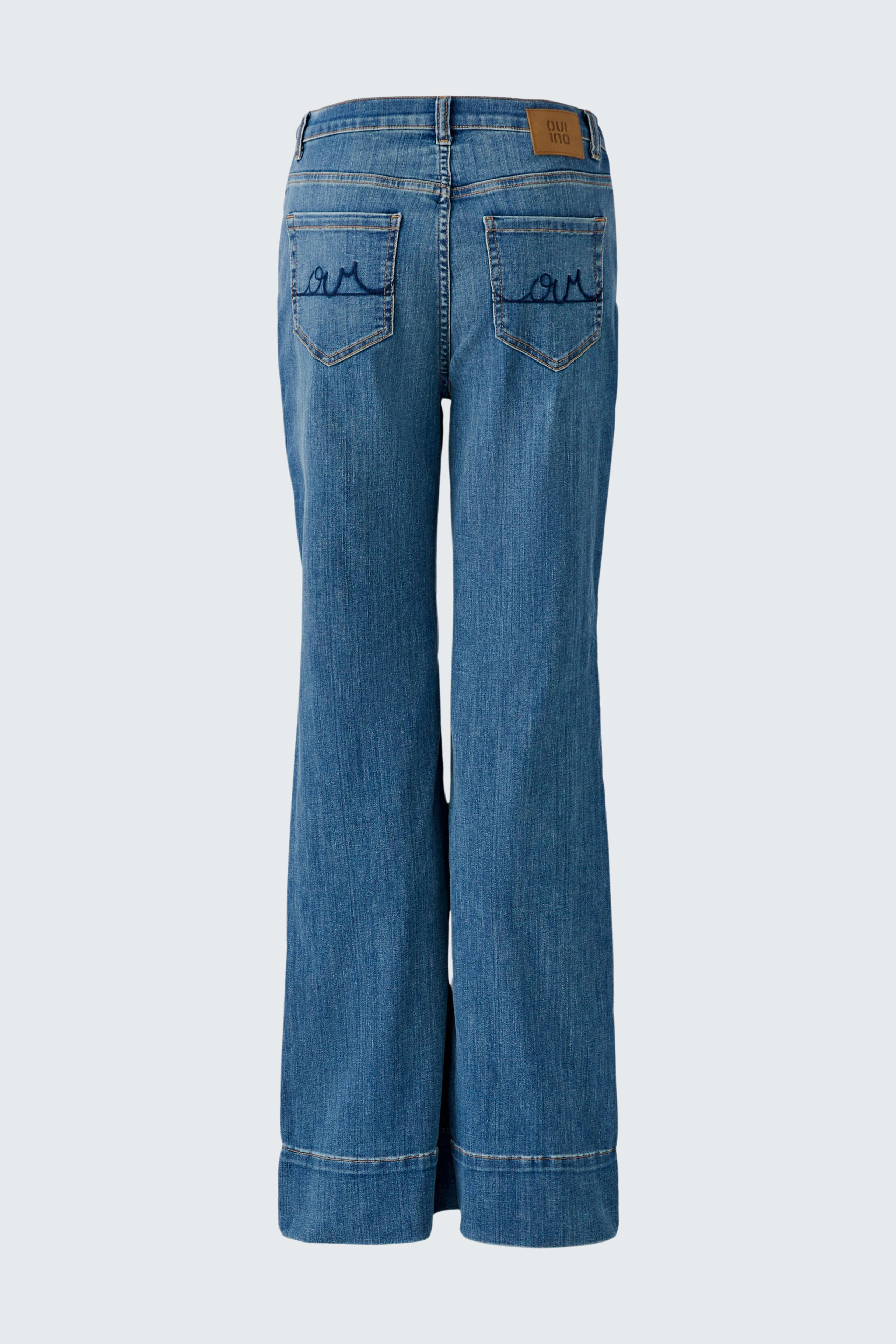 Flared jeans: Classic blue denim with wide legs, back pockets, and subtle stitching details.