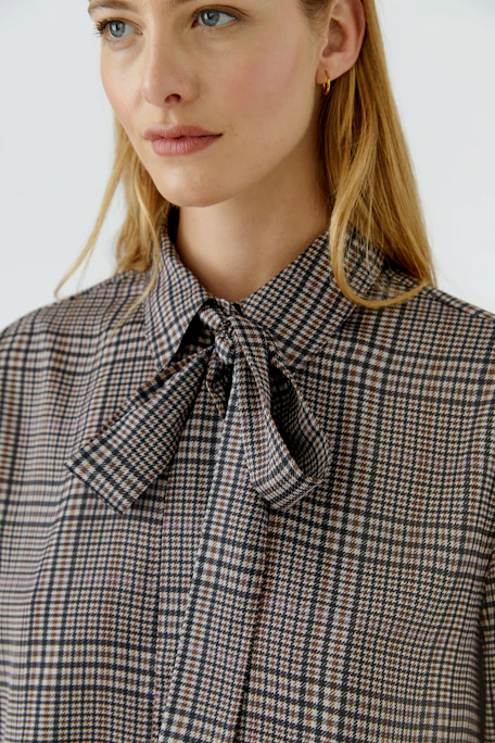 Plaid pussy-bow blouse: Classic check pattern with a stylish bow tie, perfect for versatile styling.