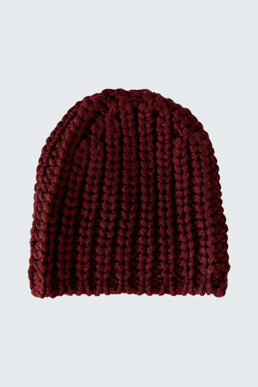 Chunky knit beanie in deep red, perfect for cozy warmth and style.