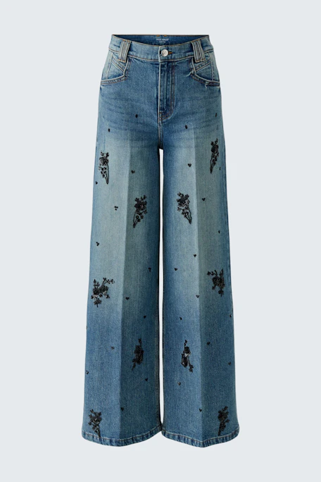 Wide leg jeans with floral print, no model. Casual and stylish for everyday wear.