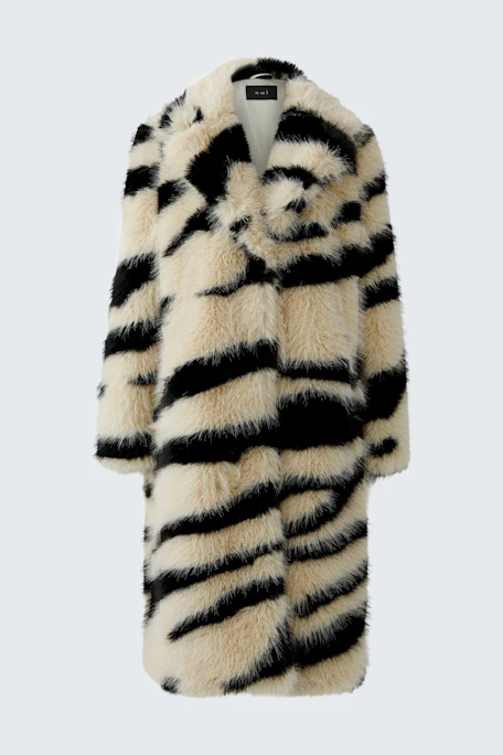 Bold winter coat: Faux fur coat with black and white stripes, perfect for a striking winter look.