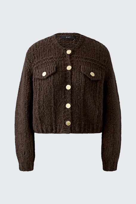 Chunky knit cardigan with large buttons, featuring a textured design. Perfect for layering in cooler weather.